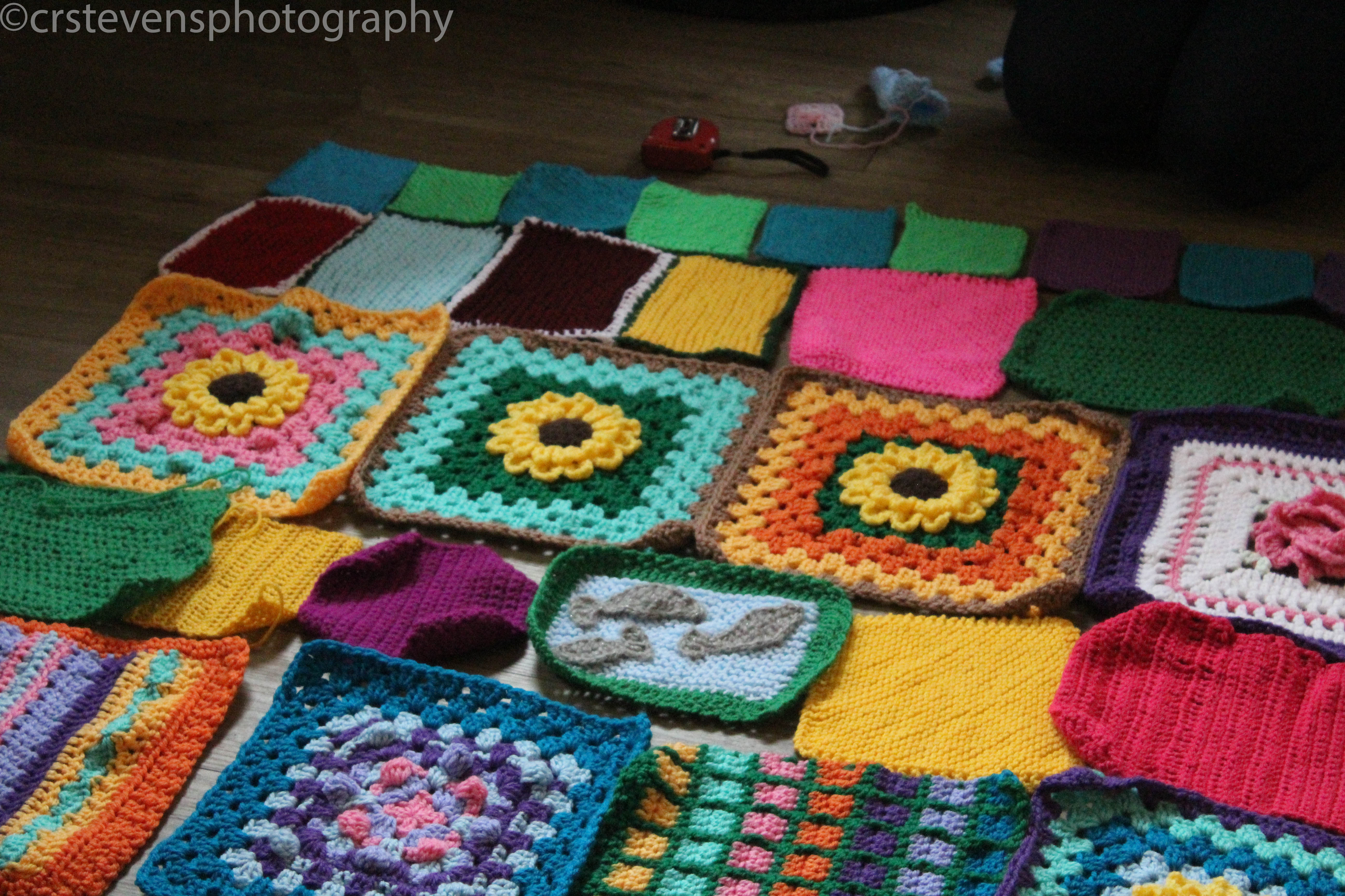 a closer up picture of some granny squares on the floor